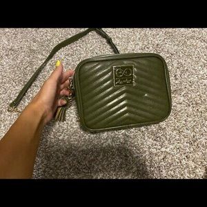 Itzy Ritzy cross body travel diaper bag.